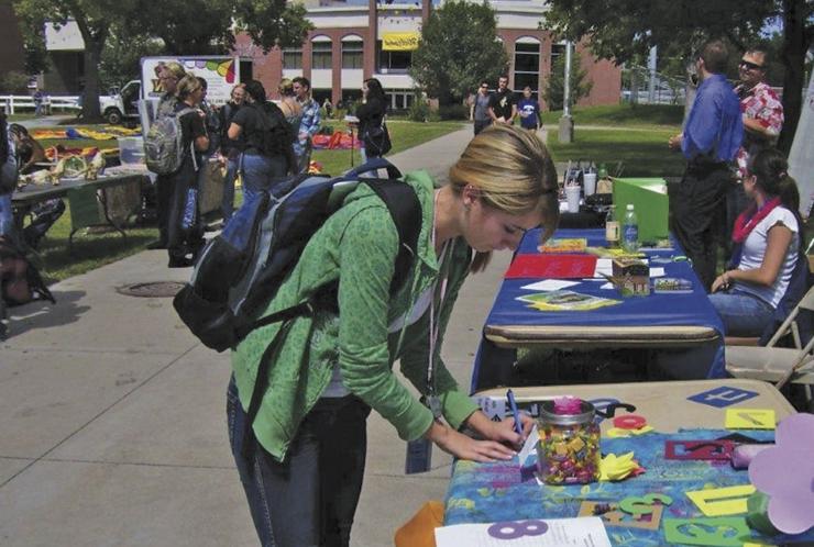 Woman working at a math booth